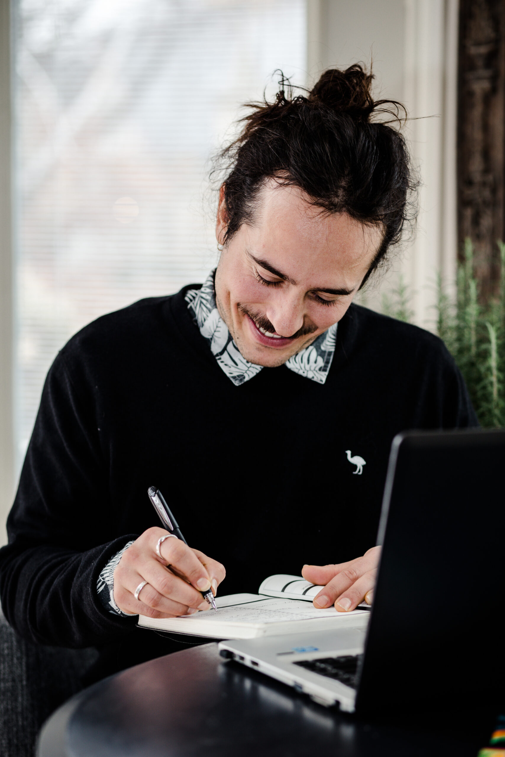 Agency owner working on digital marketing strategies at his desk.